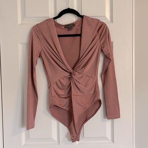 Rose coloured body suit
